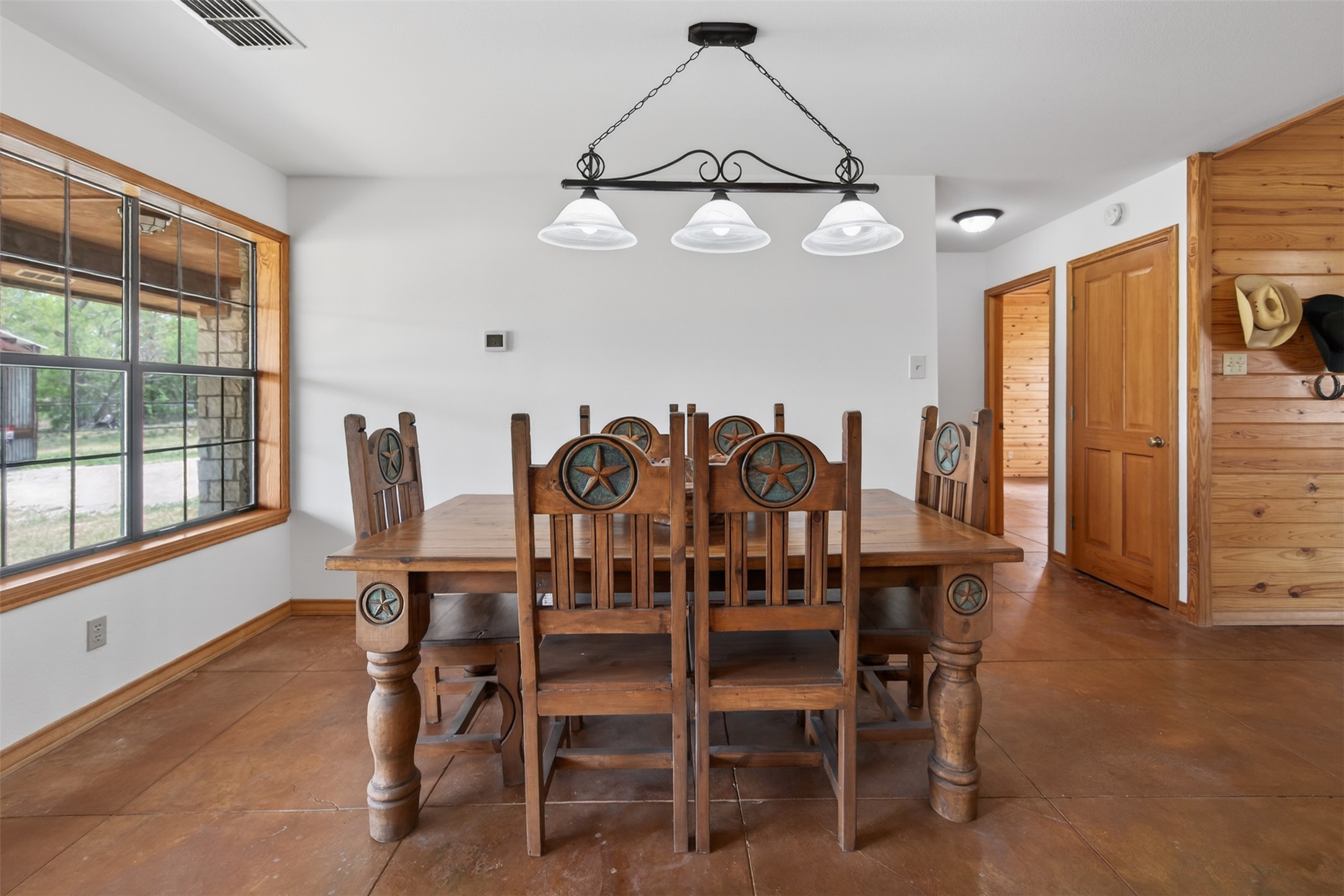 1077 Burdette Wells Road Lockhart, TX 78644 - Photo 17 of 38 a view of a dining room with furniture and window