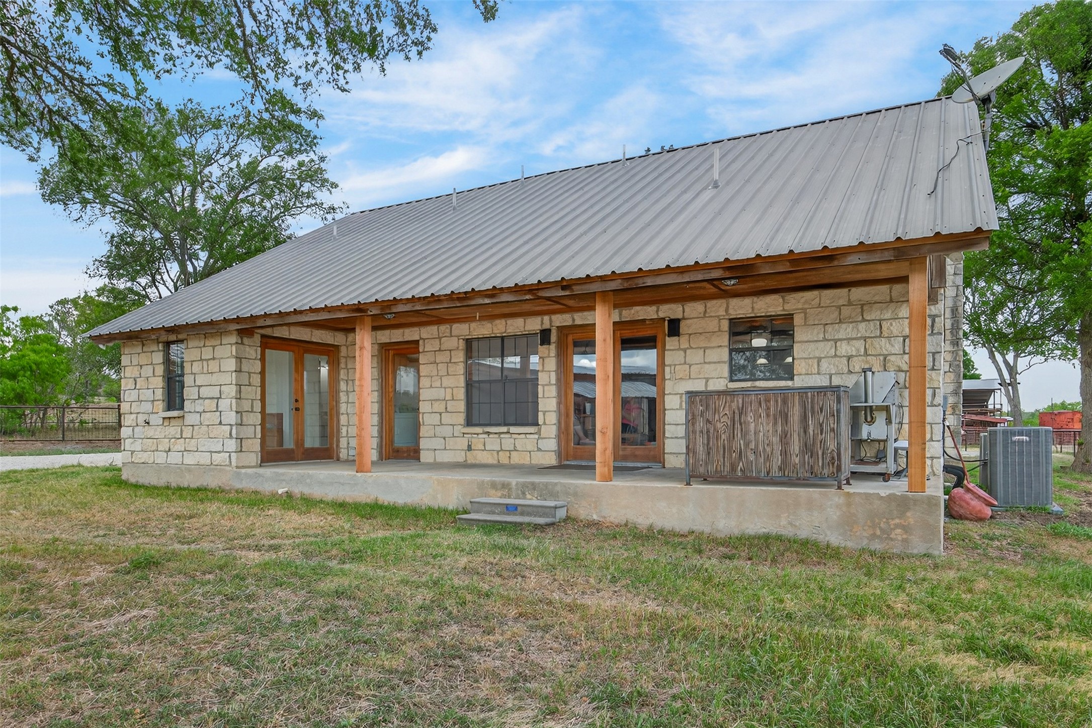 1077 Burdette Wells Road Lockhart, TX 78644 - Photo 23 of 38 front view of a house with a yard