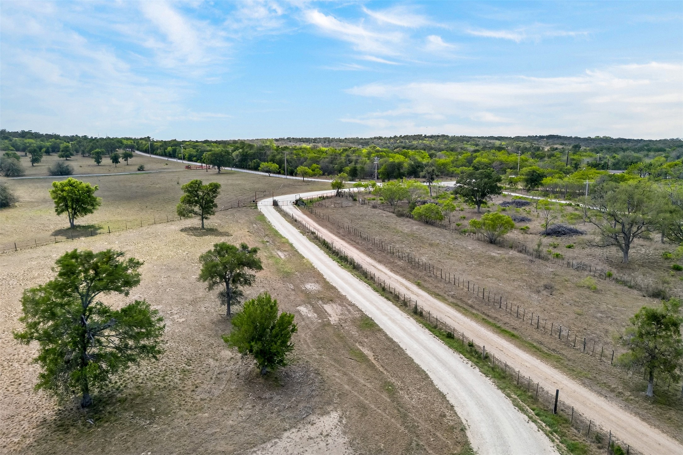 1077 Burdette Wells Road Lockhart, TX 78644 - Photo 37 of 38 a view of a lake with a city view