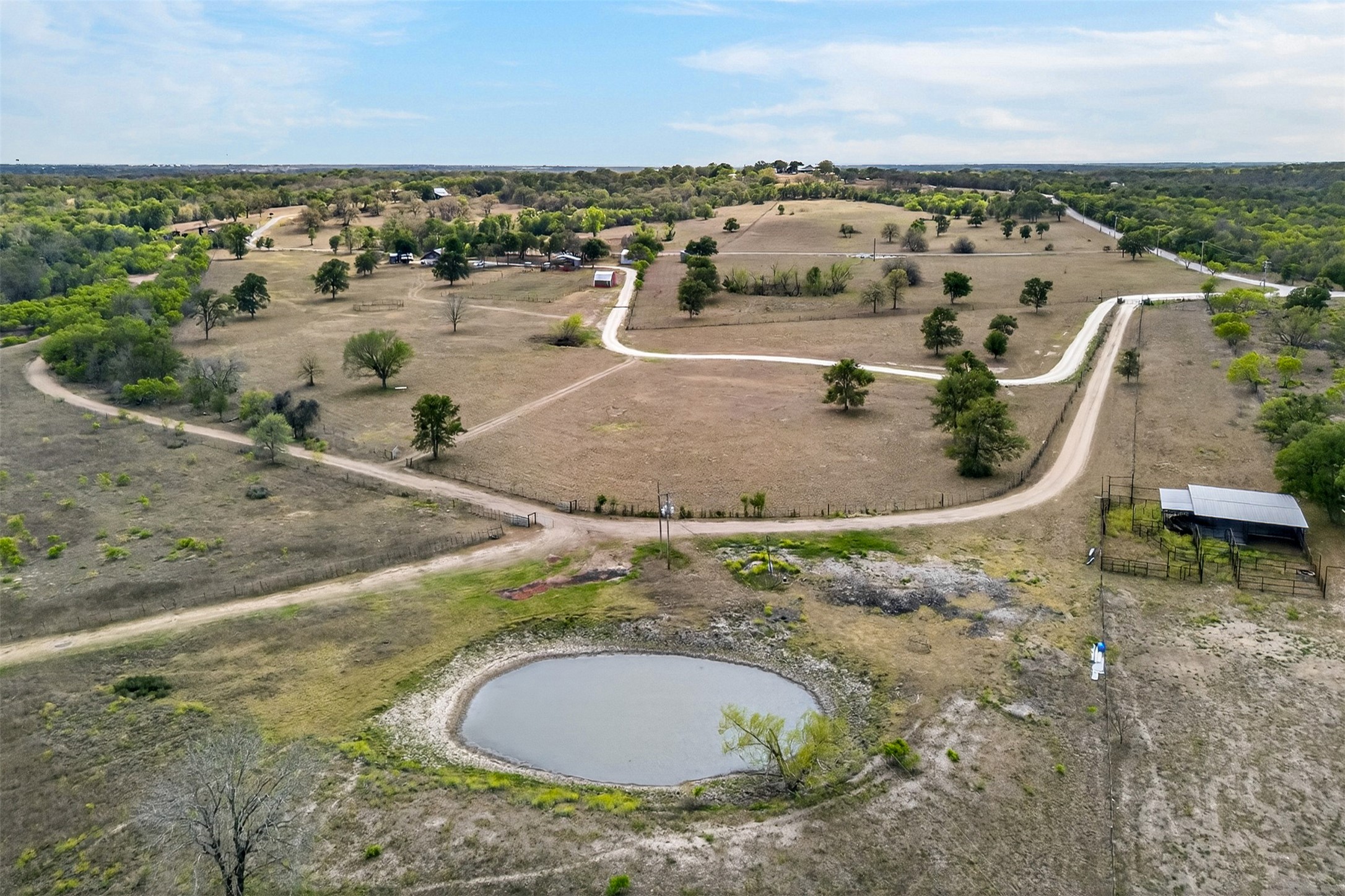 1077 Burdette Wells Road Lockhart, TX 78644 - Photo 38 of 38 a view of a swimming pool with a yard