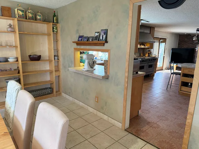 a view of kitchen with furniture and wooden floor