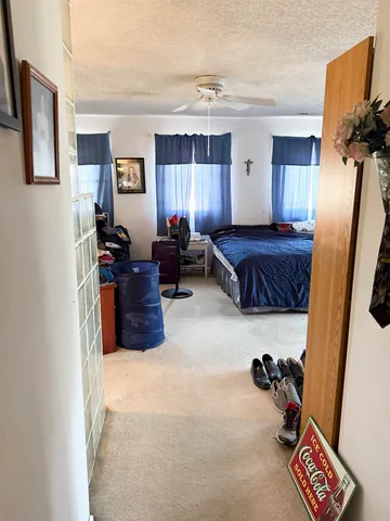 a bedroom with furniture and a window