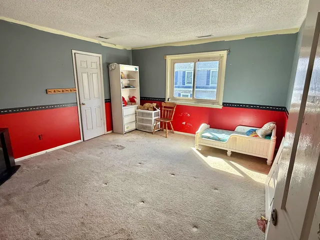 a bed room with a bed and a couch