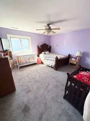 a bedroom with furniture and a window