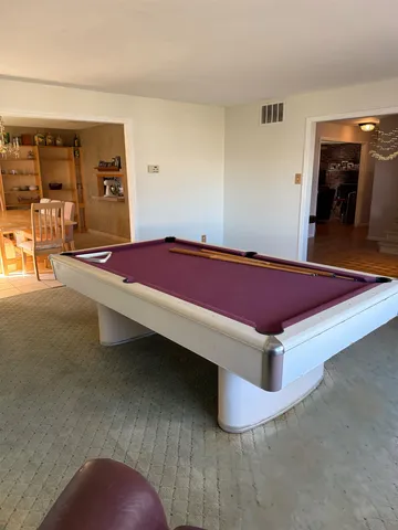 a room with pool table