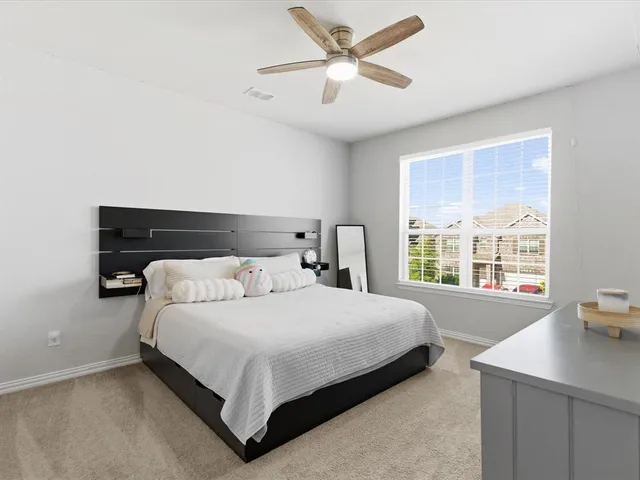 a bedroom with a bed and window