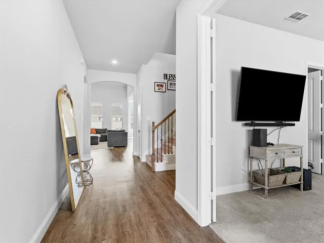 a view of a livingroom with furniture and a flat screen tv