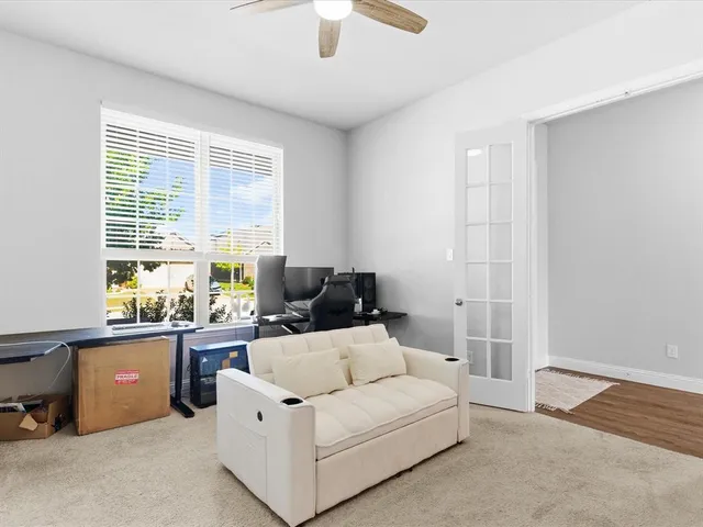 a living room with furniture and a window