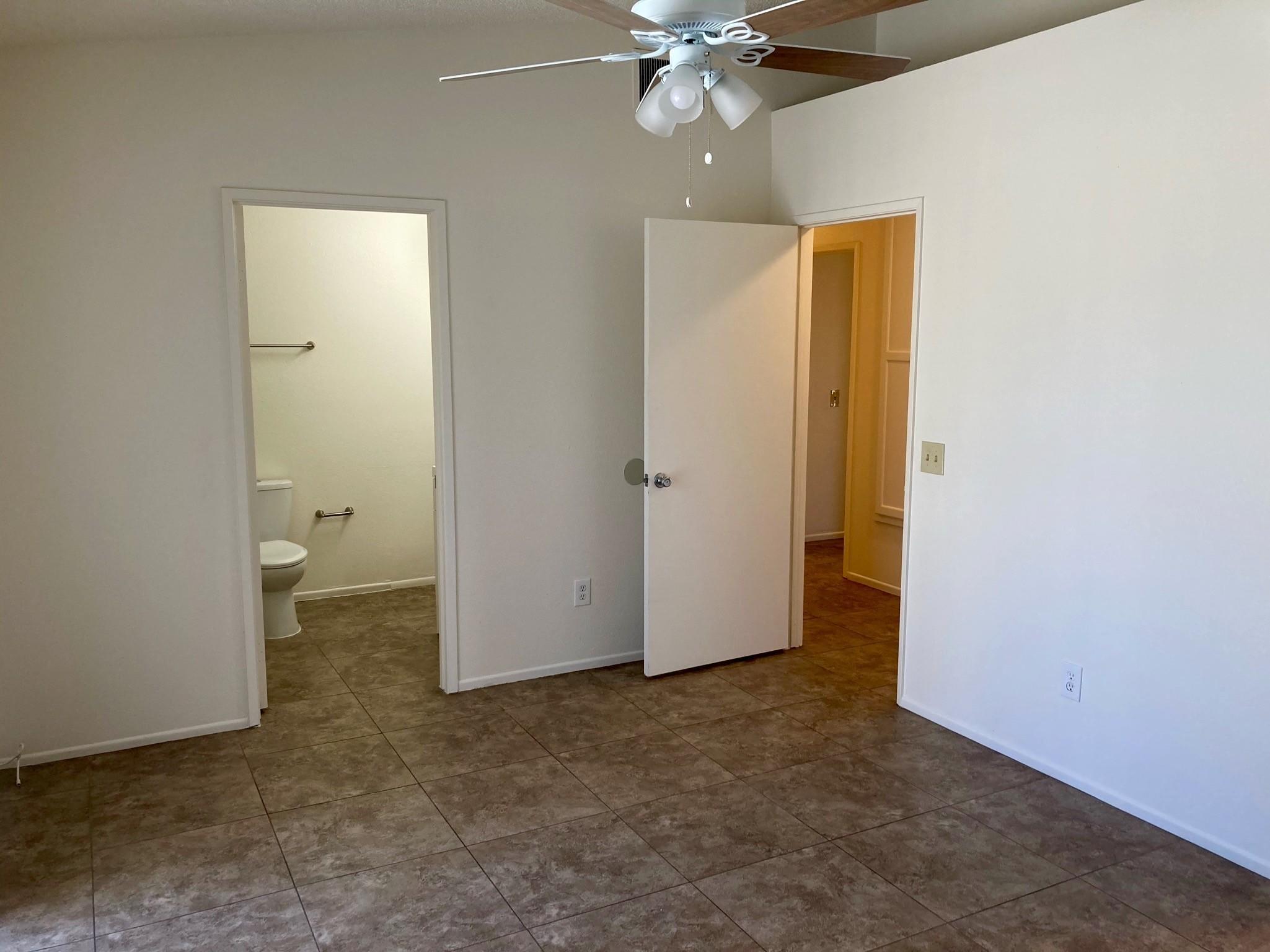 41680 Maroon Town Road, Unit B Bermuda Dunes, CA 92203 - Photo 14 of 19 an empty room with closet and a chandelier fan