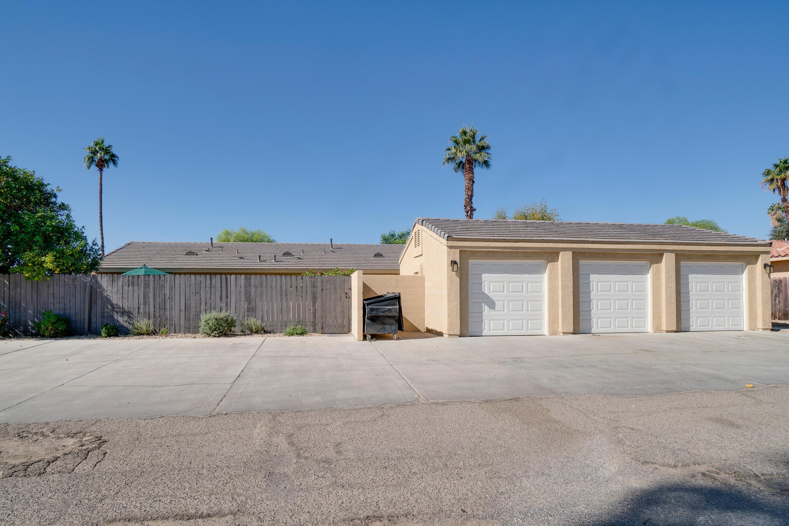 41680 Maroon Town Road, Unit B Bermuda Dunes, CA 92203 - Photo 3 of 19 a view of a house with a yard and a garage