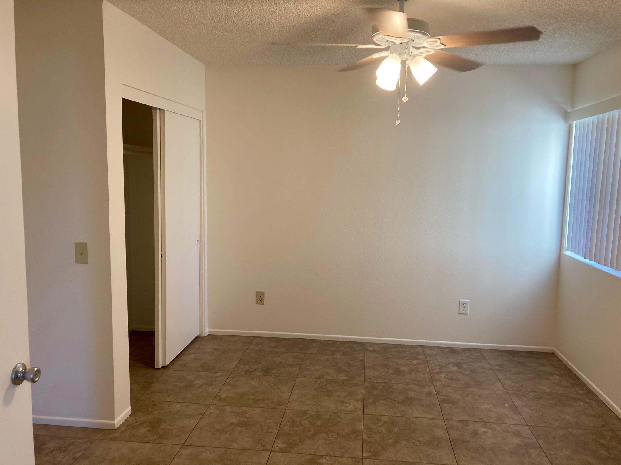 41680 Maroon Town Road, Unit B Bermuda Dunes, CA 92203 - Photo 10 of 19 an empty room with a fan and a window