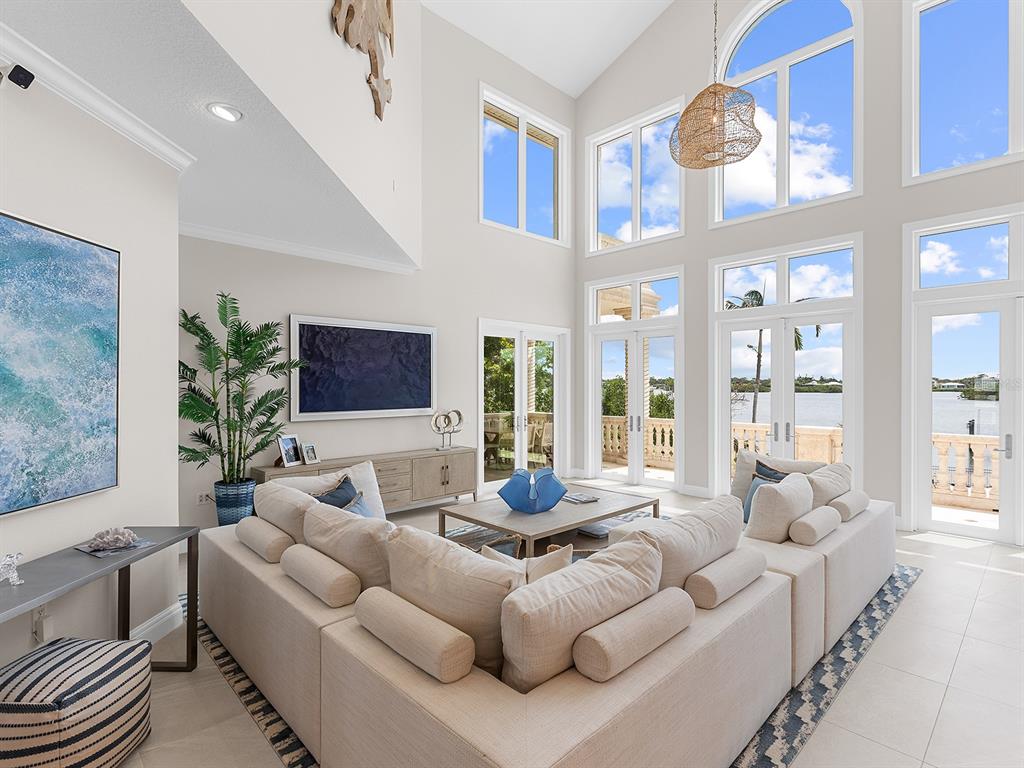 144 North Casey Key Road Nokomis, FL 34275 - Photo 13 of 54 a living room with furniture and a flat screen tv