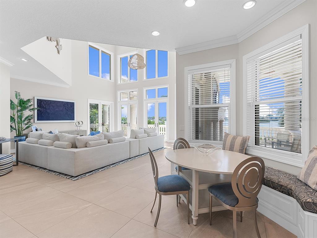 144 North Casey Key Road Nokomis, FL 34275 - Photo 18 of 54 a living room with furniture and a large window