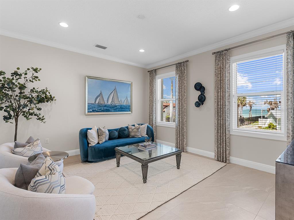 144 North Casey Key Road Nokomis, FL 34275 - Photo 23 of 54 a living room with furniture and a potted plant