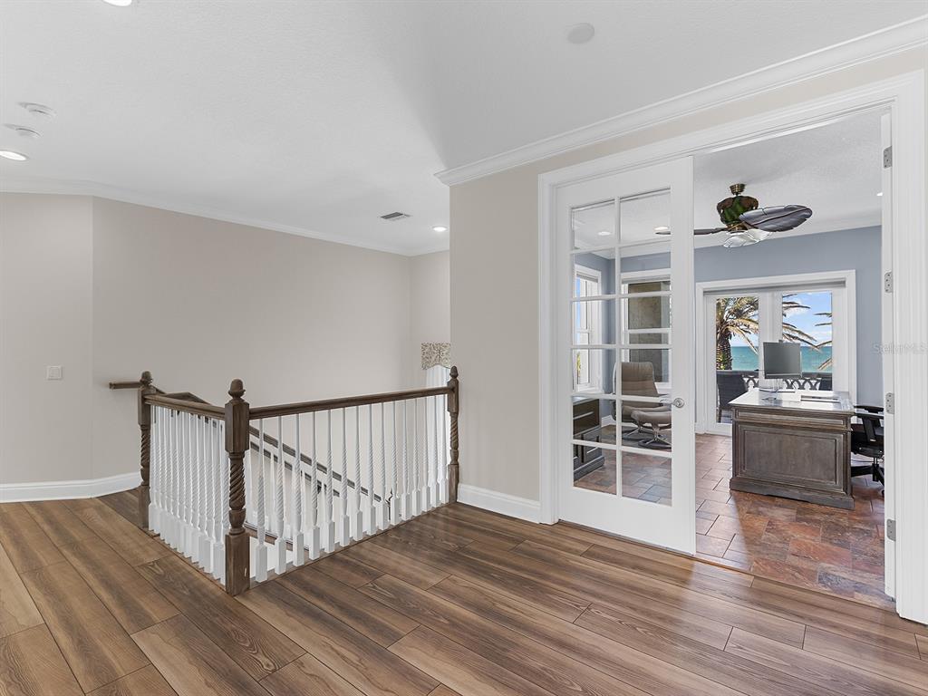 144 North Casey Key Road Nokomis, FL 34275 - Photo 29 of 54 a view of a livingroom with wooden floor and furniture