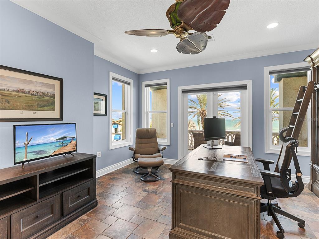 144 North Casey Key Road Nokomis, FL 34275 - Photo 30 of 54 a living room with furniture gym equipment and a large window
