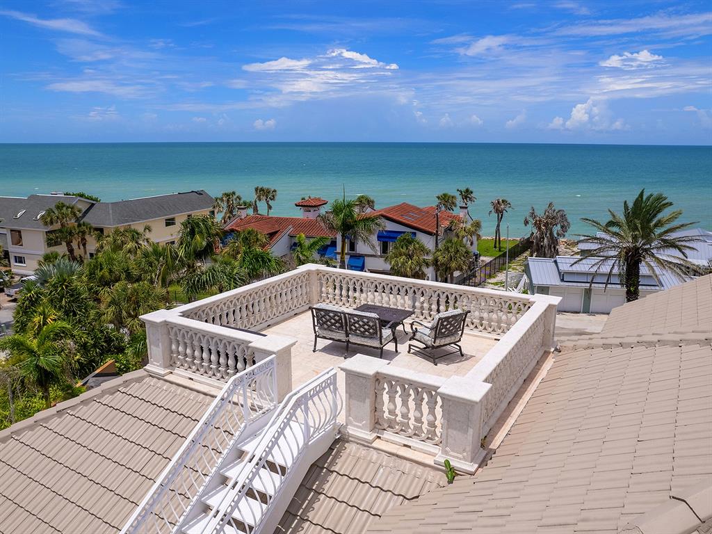 144 North Casey Key Road Nokomis, FL 34275 - Photo 3 of 54 a view of a balcony with two chairs
