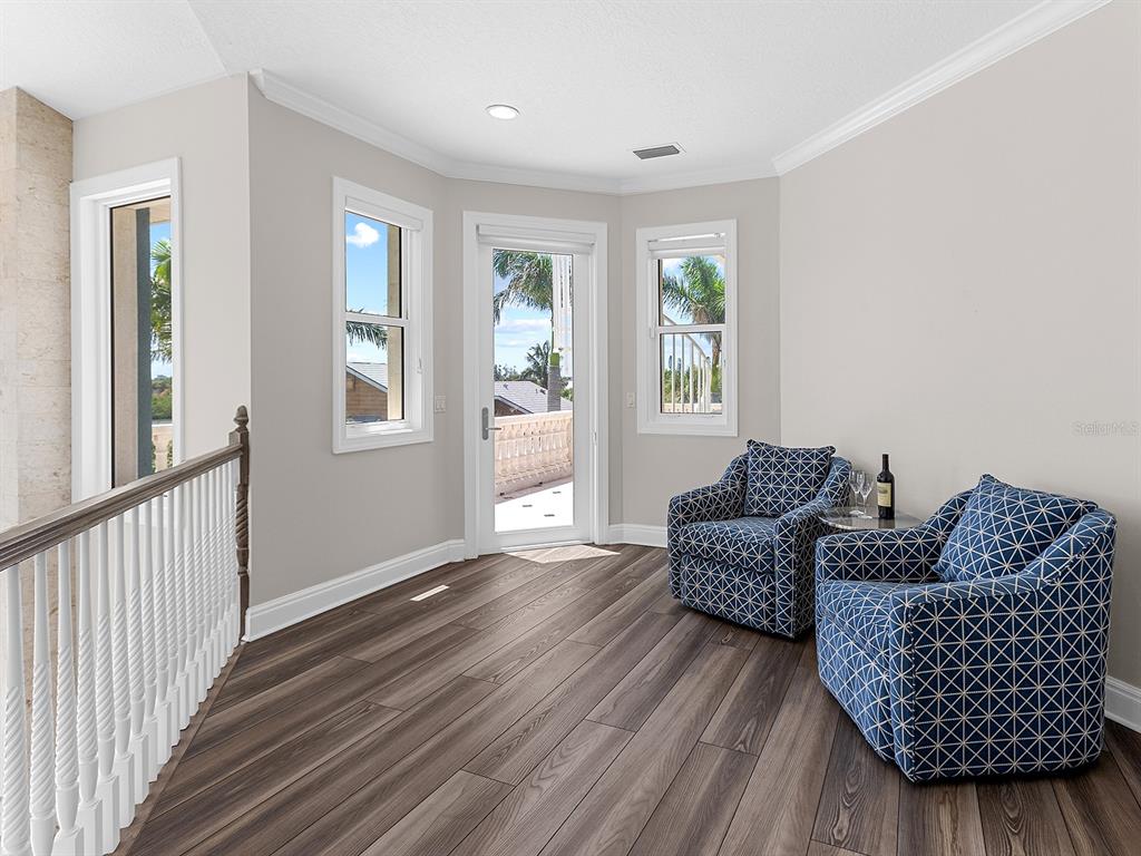 144 North Casey Key Road Nokomis, FL 34275 - Photo 32 of 54 a living room with furniture and a window