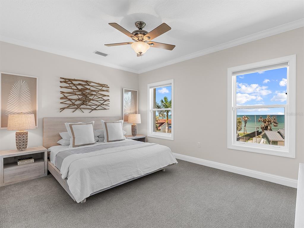 144 North Casey Key Road Nokomis, FL 34275 - Photo 38 of 54 a bedroom with a large bed and a window