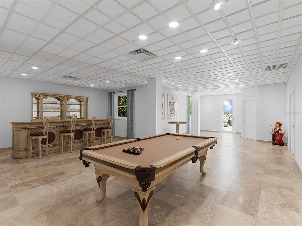 144 North Casey Key Road Nokomis, FL 34275 - Photo 39 of 54 a room with furniture pool table and flat screen tv