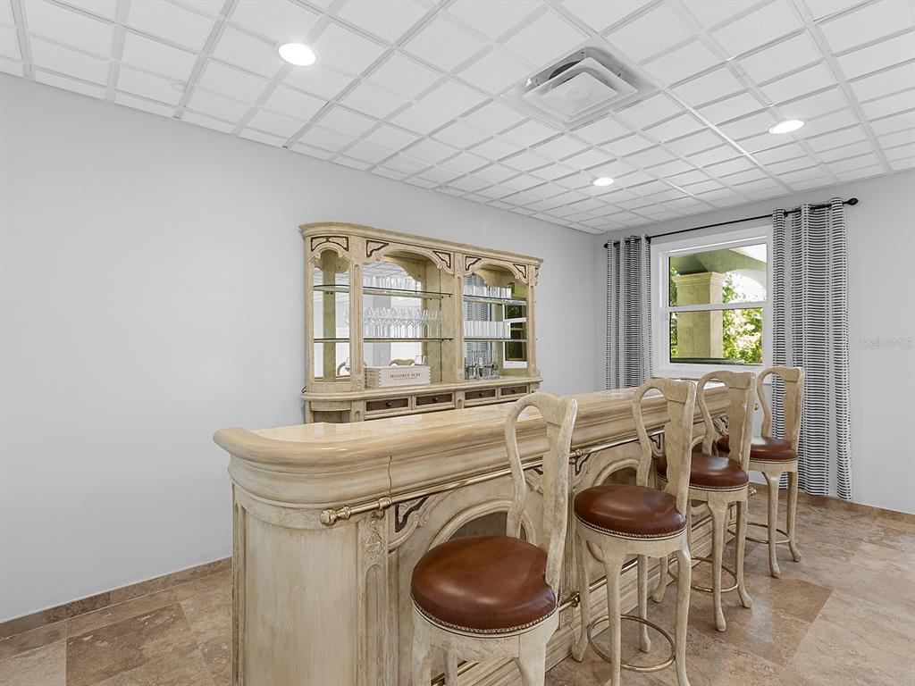 144 North Casey Key Road Nokomis, FL 34275 - Photo 40 of 54 a view of a dining room with furniture and a chandelier