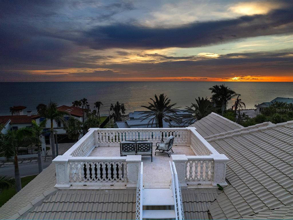 144 North Casey Key Road Nokomis, FL 34275 - Photo 43 of 54 a view of a roof deck with potted plants and wooden floor