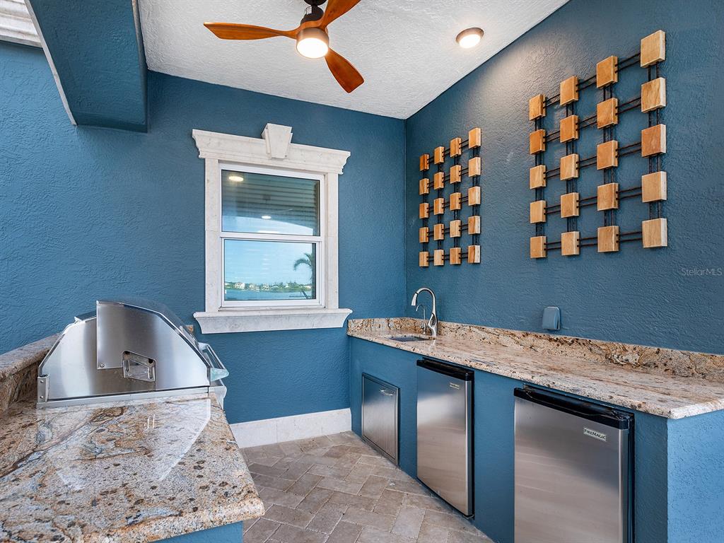 144 North Casey Key Road Nokomis, FL 34275 - Photo 46 of 54 a kitchen with a sink a stove and a window