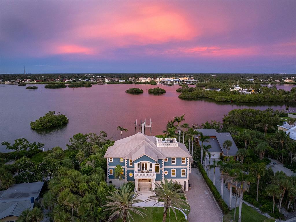 144 North Casey Key Road Nokomis, FL 34275 - Photo 50 of 54 a view of a lake with a building in the background