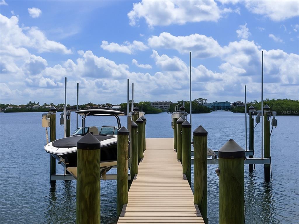 144 North Casey Key Road Nokomis, FL 34275 - Photo 51 of 54 a view of a lake with sitting area
