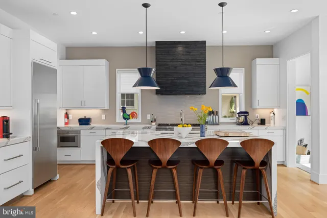 a view of a bedroom with baby crib and a window