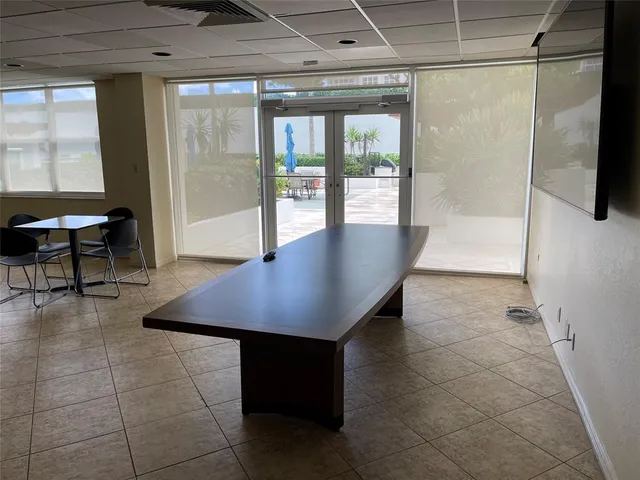 a view of livingroom with furniture and floor to ceiling window
