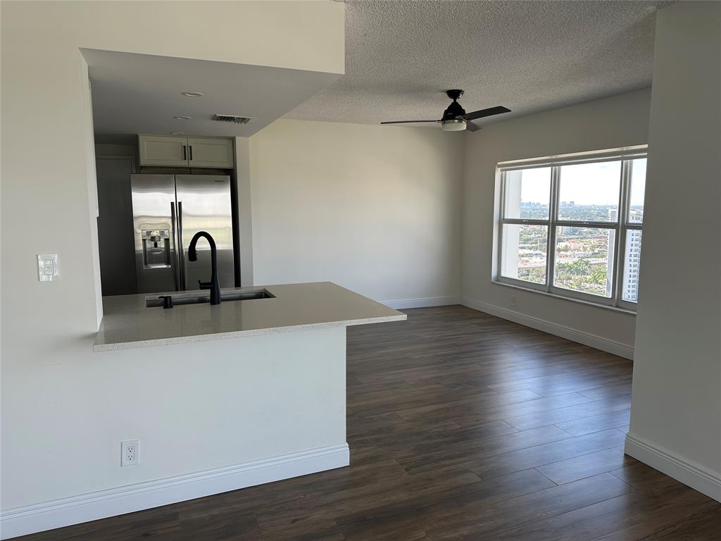 3550 Galt Ocean Drive, Unit 1907 Fort Lauderdale, FL 33308 - Photo 6 of 28 wooden floor in an empty room with a window