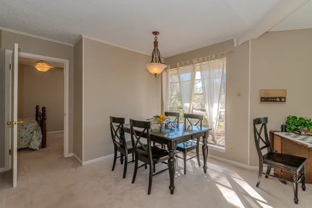 a kitchen that has a sink cabinets and a window