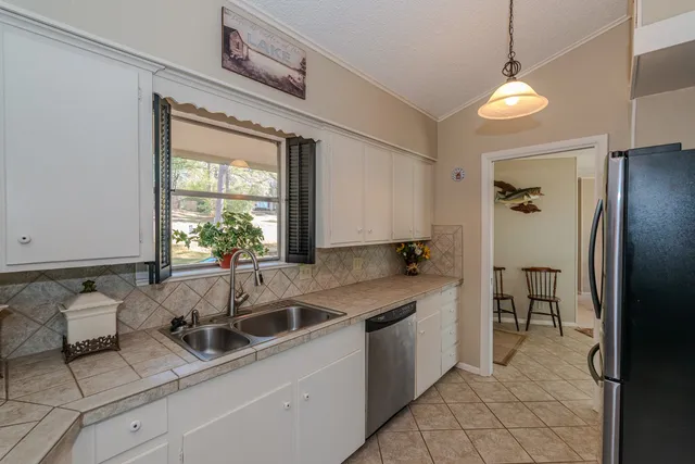 a bathroom with a bathtub and a sink