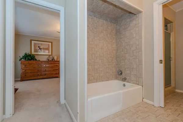 a bathroom with a bathtub and a sink