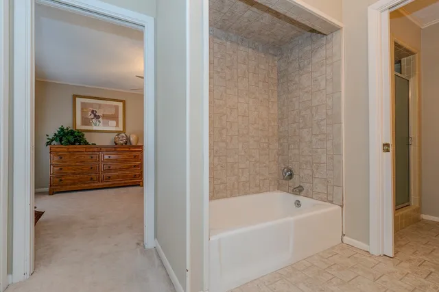 a bedroom with a bed and cabinets