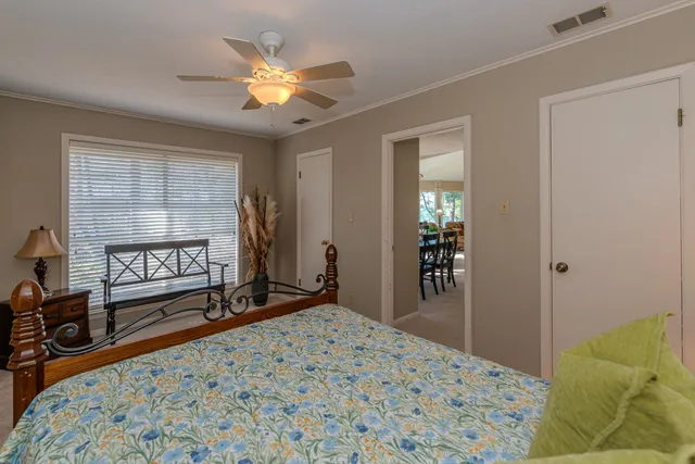 a bedroom with a bed and a closet