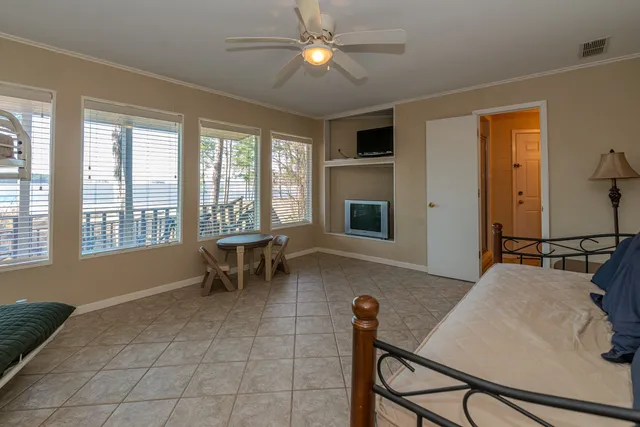 a view of a balcony with lake view and wooden floor
