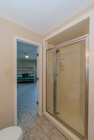 a view of a balcony with chairs and wooden floor