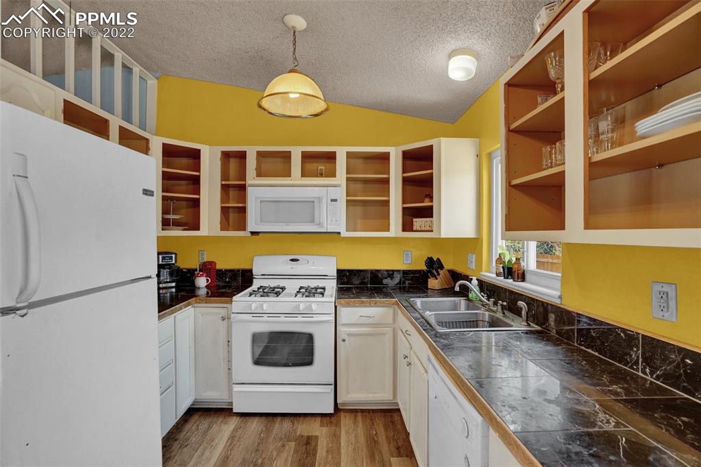 629 Blossom Field Road Fountain, CO 80817 - Photo 14 of 25 a kitchen that has a stove and a sink