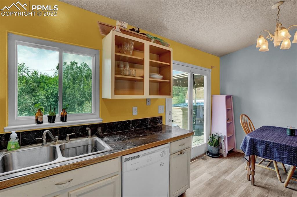 629 Blossom Field Road Fountain, CO 80817 - Photo 16 of 25 a kitchen with a sink and a large window