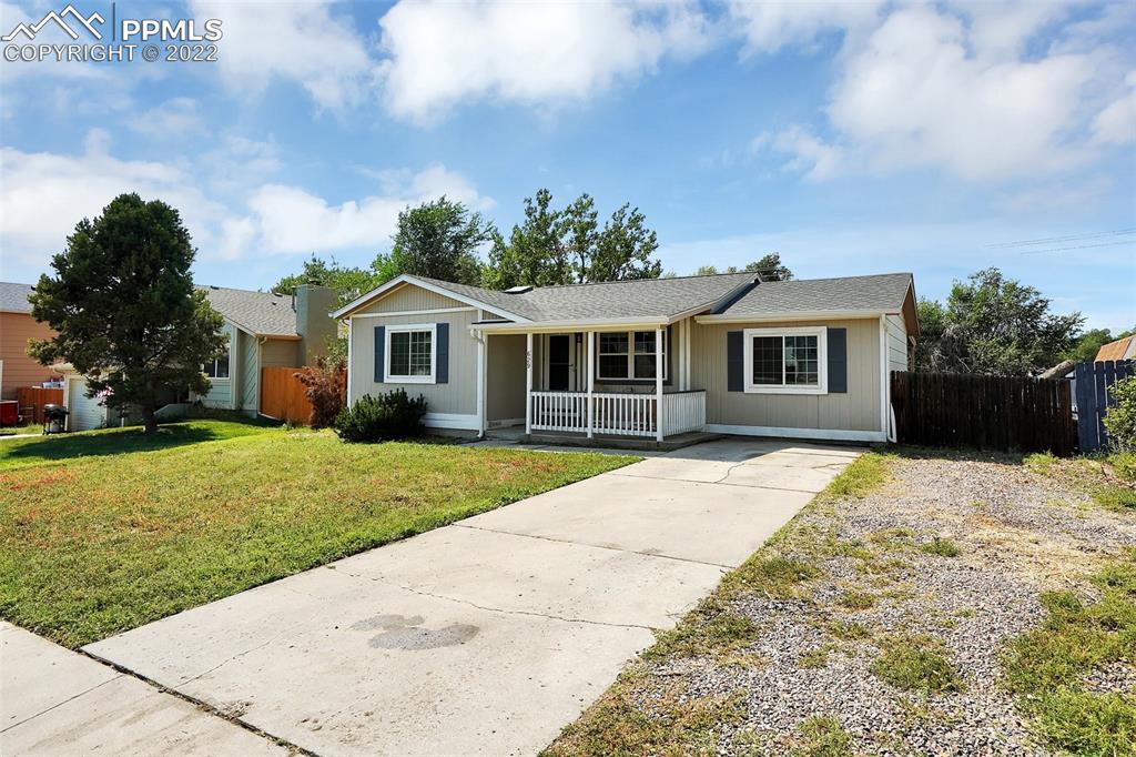629 Blossom Field Road Fountain, CO 80817 - Photo 2 of 25 a front view of a house with a garden