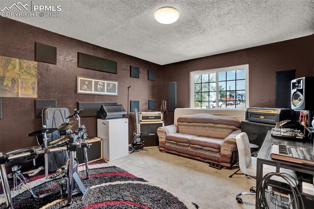 629 Blossom Field Road Fountain, CO 80817 - Photo 21 of 25 a bedroom with furniture and a window