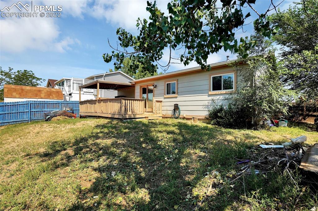 629 Blossom Field Road Fountain, CO 80817 - Photo 25 of 25 a view of a house with a backyard