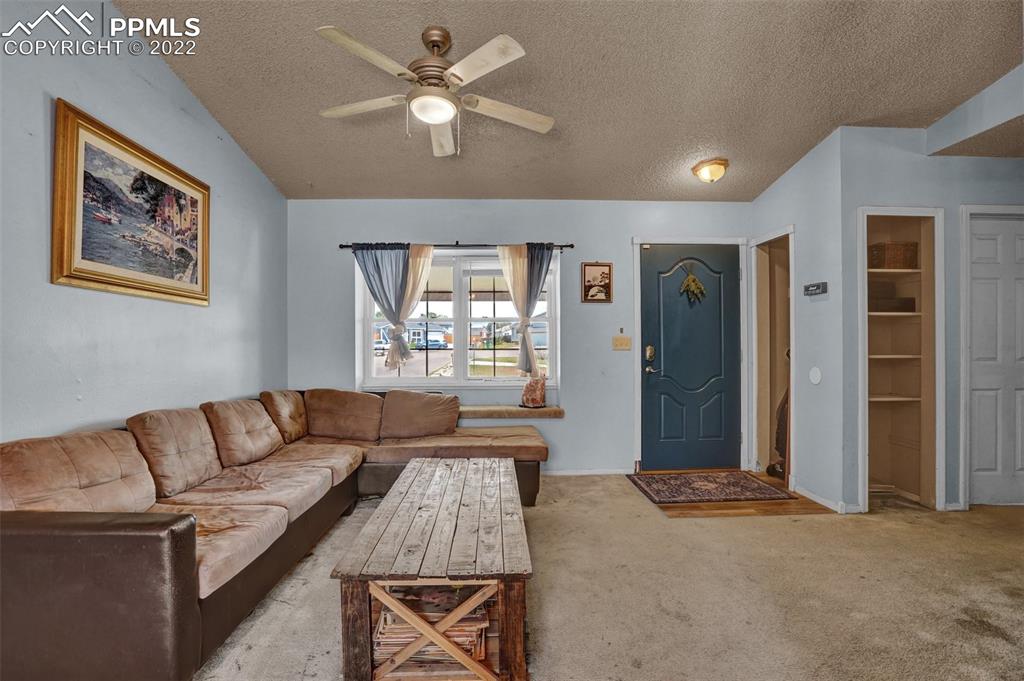 629 Blossom Field Road Fountain, CO 80817 - Photo 4 of 25 a living room with furniture and a window
