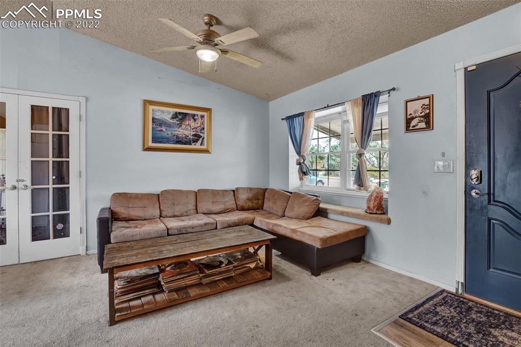629 Blossom Field Road Fountain, CO 80817 - Photo 8 of 25 a living room with furniture and a window