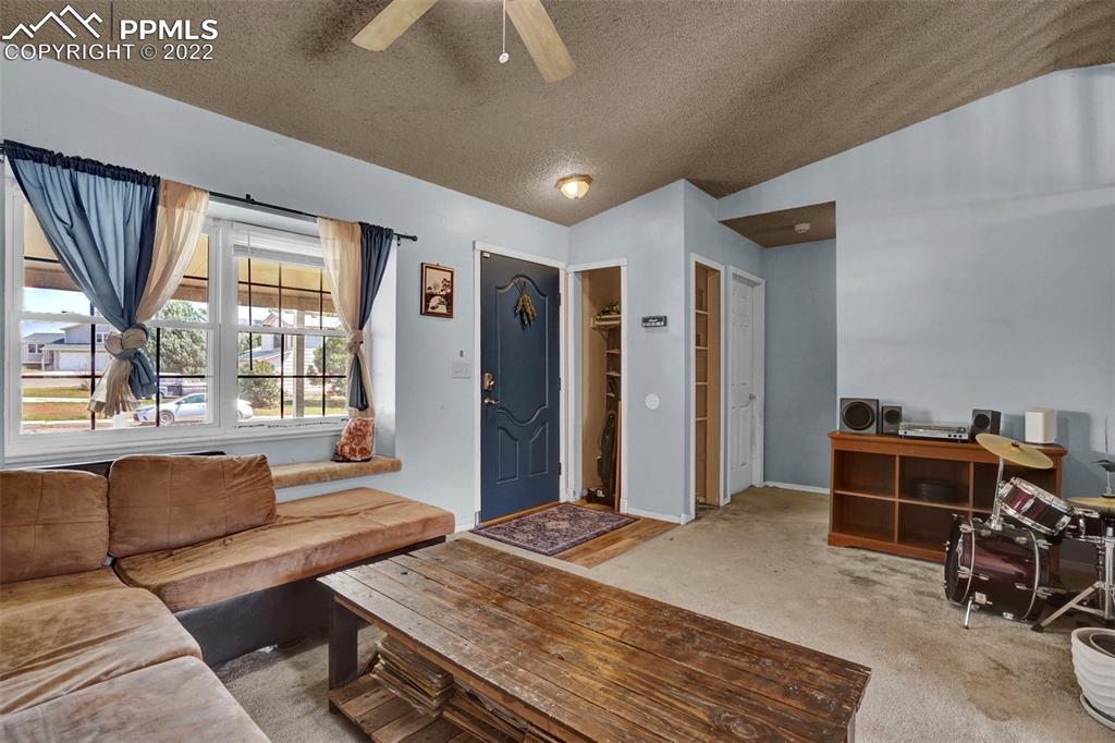 629 Blossom Field Road Fountain, CO 80817 - Photo 9 of 25 a bedroom with furniture and a large window