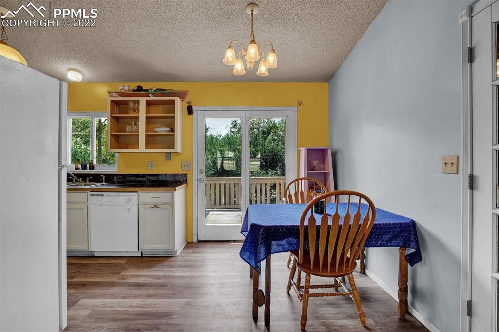 629 Blossom Field Road Fountain, CO 80817 - Photo 10 of 25 a view of a dining room with furniture window and outside view