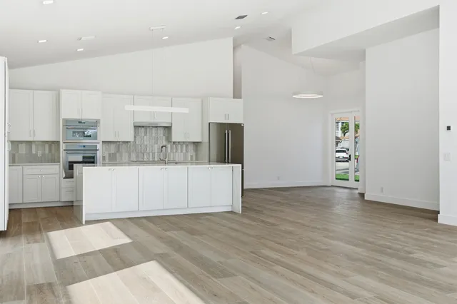 a bathroom with a double vanity sink mirror and