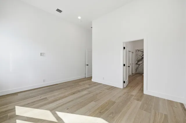 a bathroom with a shower and a glass door